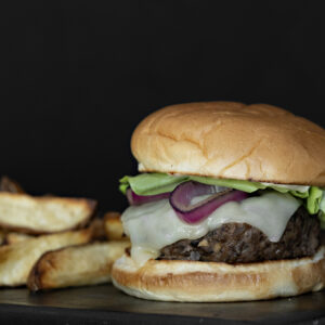 Bison burger with fries plated. Recipe by members of the White Earth 4-H Club