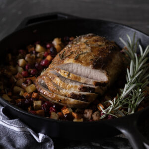 Holiday pork roast in cast iron pan.